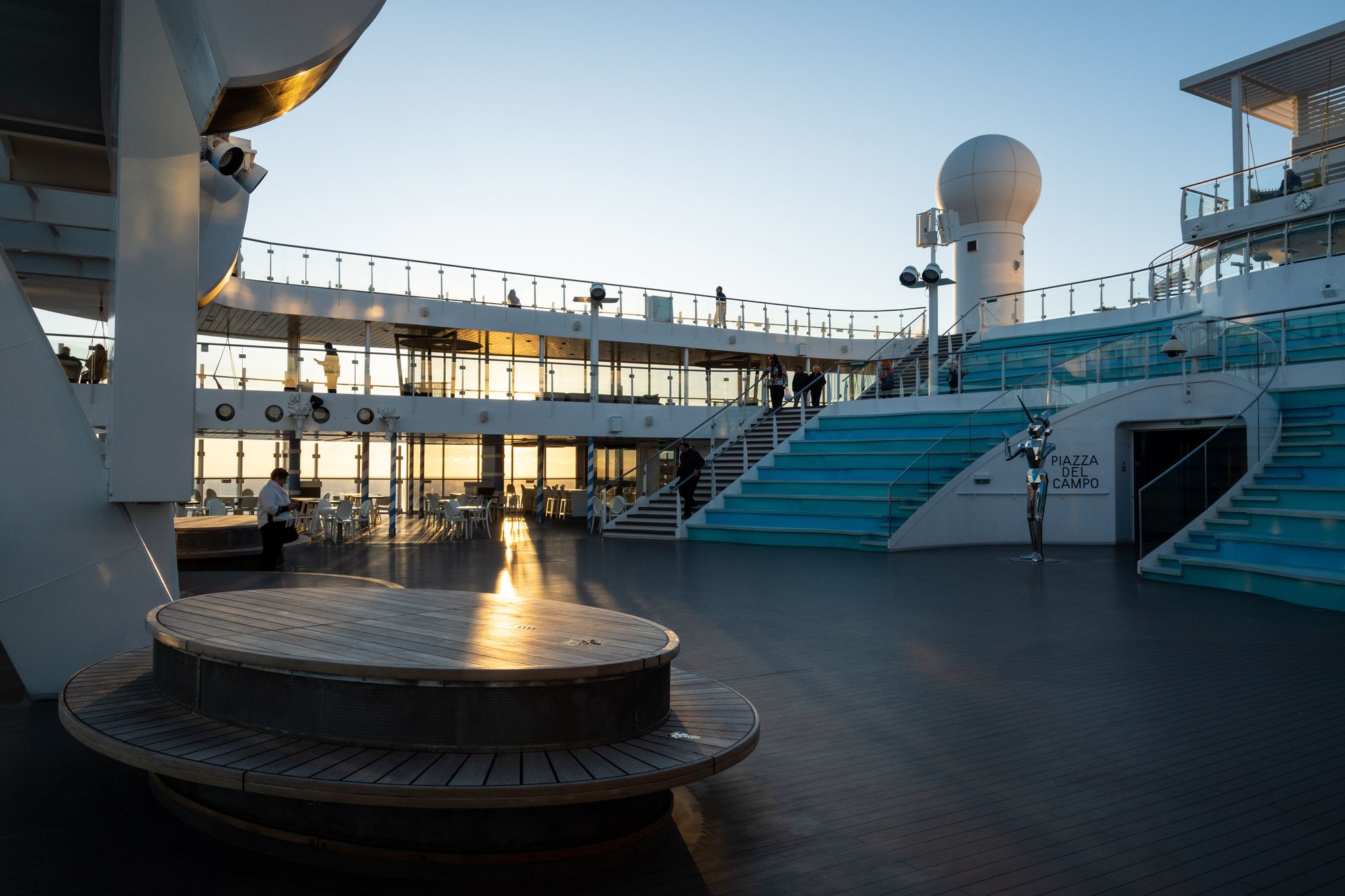 Elegant cruise ship deck at sunset with ocean views