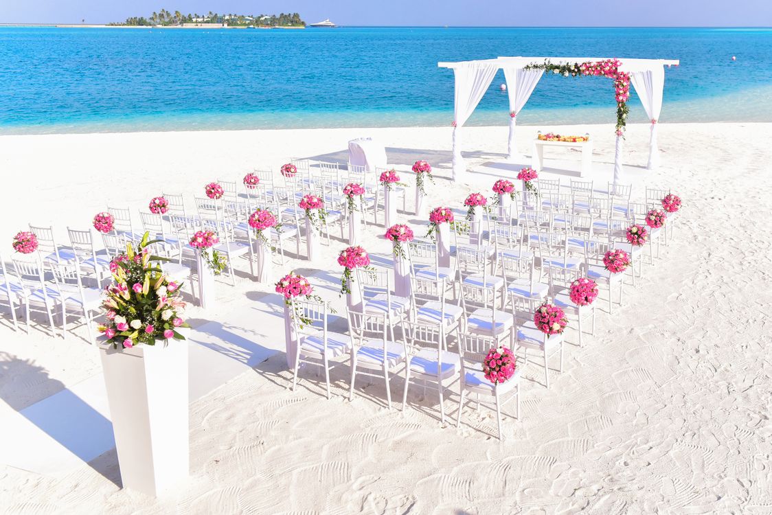 Romantic white beach wedding setup on pristine Caribbean sand