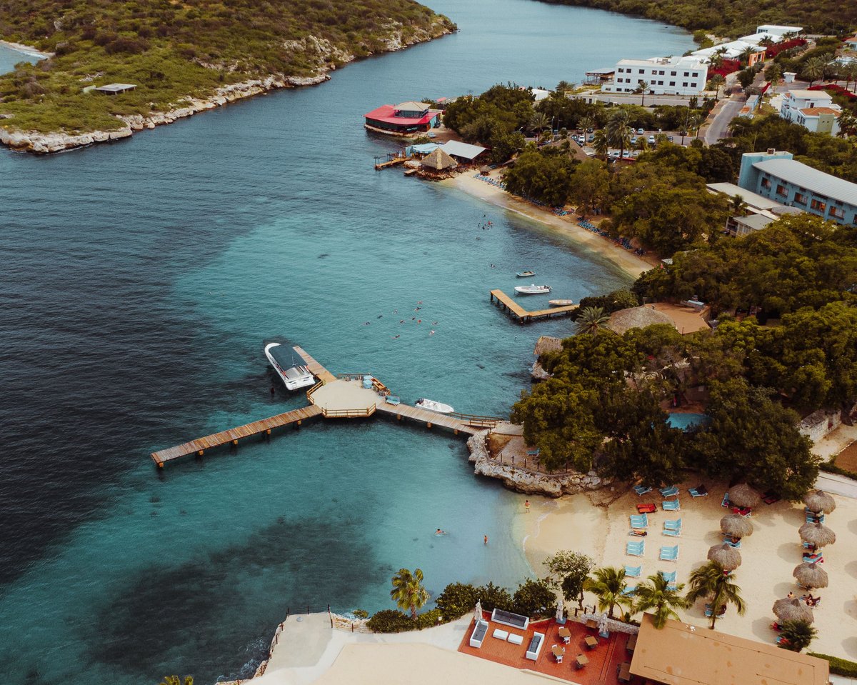 Aerial view of a Curaçao resort — the closest Sandals climate match to Aruba's dry, sunny conditions.