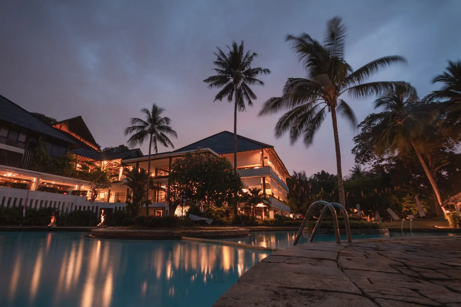 Overwater bungalows and volcanic coastline at Sandals Grenada