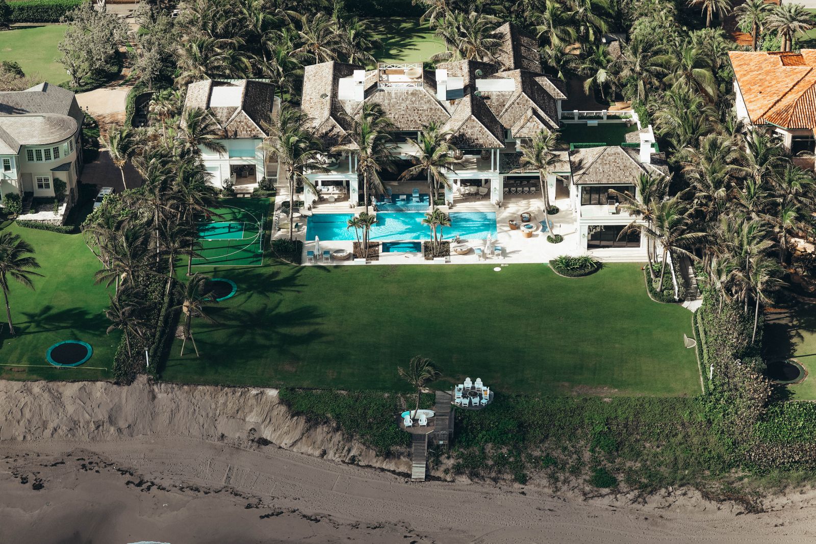 An aerial view of a sprawling Caribbean resort with multiple pools and palm trees — the scale of inventory that makes last-minute June deals possible.
